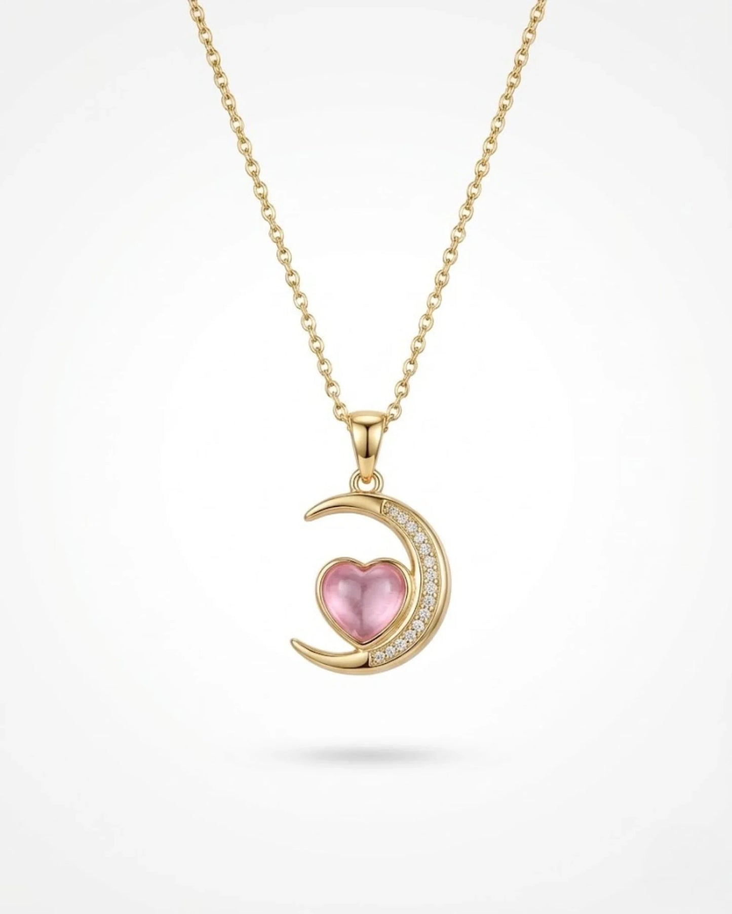 gold moon charm necklace with pink stone